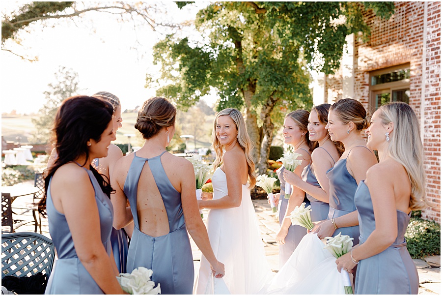 Ladies helping carry brides dress
