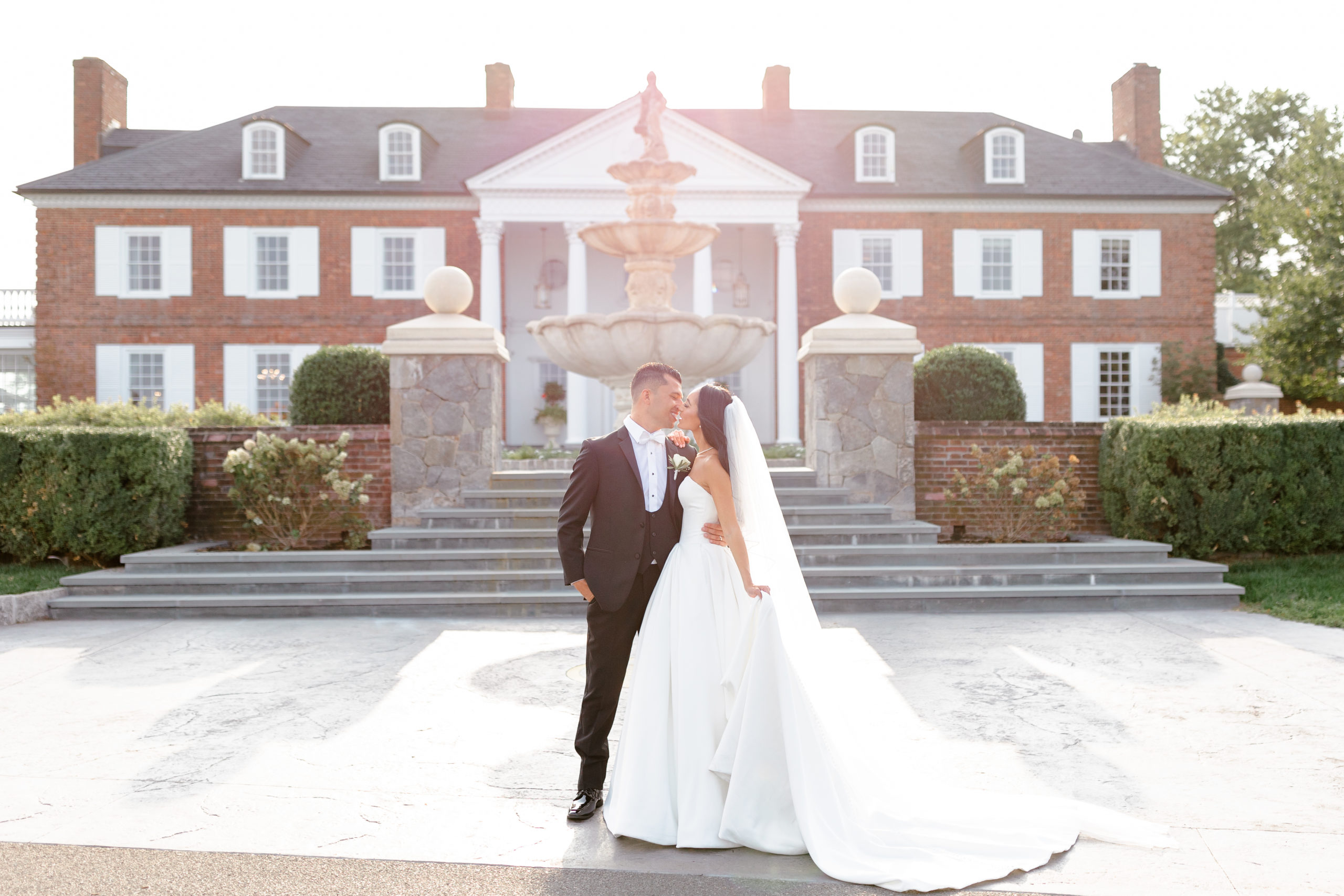 bride and groom portraits in front of Trump National Bedminster