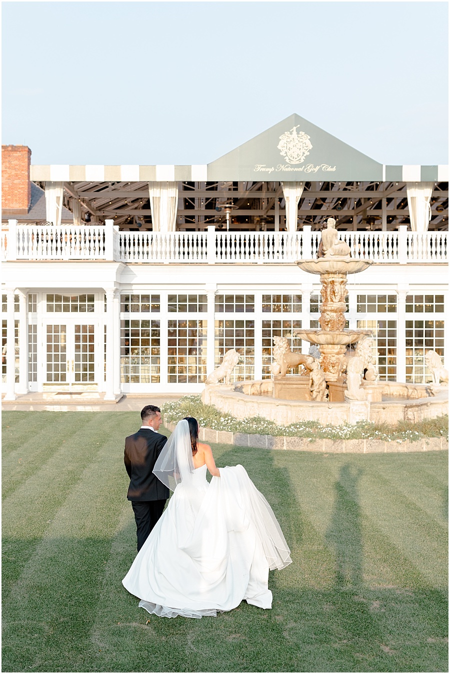 bride and groom sunset portraits in front of Trump National Bedminster