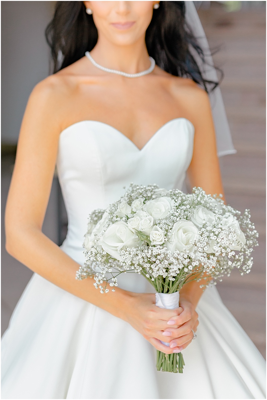 brides plain white roses and baby breaths bouquet by jardiniere fine flowers